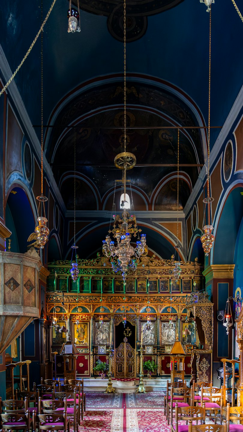 Ornate golden iconostasis inside a historic Orthodox church.
